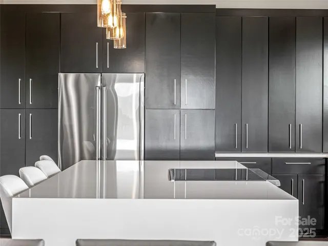 a kitchen with a sink and a refrigerator