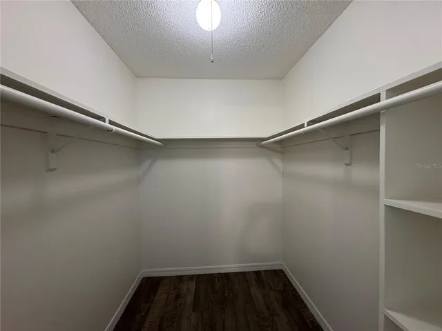 a view of a room with racks on the wall