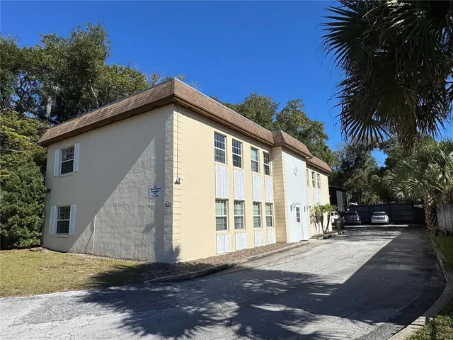 a view of a house with a yard