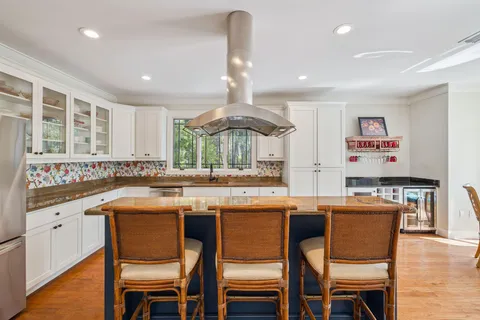 a view of a chairs and table in a livingroom