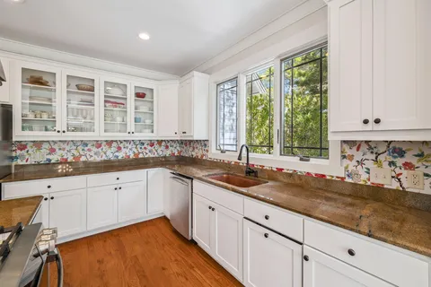 a dining room with furniture window and outside view