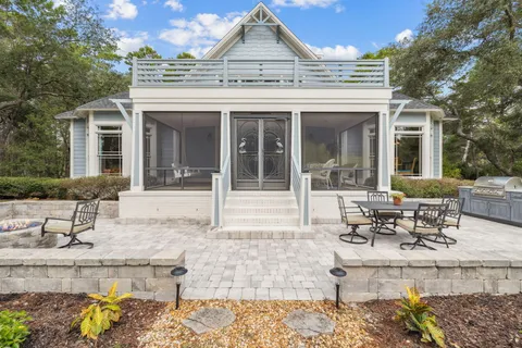 a front view of house with yard outdoor seating and covered with green space