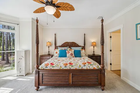 a bathroom with a granite countertop sink toilet mirror and shower