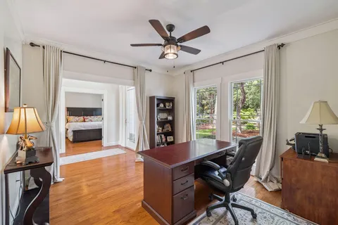 a view of a swimming pool and a chairs