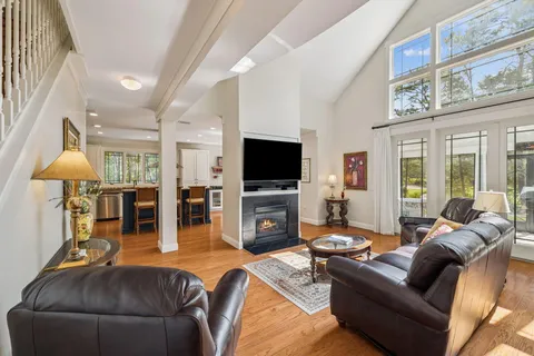 a living room with furniture and a table
