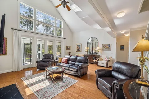 a kitchen with stainless steel appliances granite countertop a sink a stove and a refrigerator