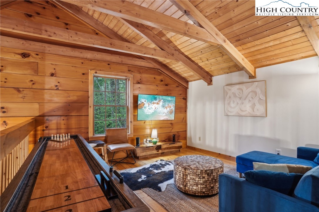 909 Niley Cook Road Blowing Rock, NC 28605 - Photo 11 of 45 a living room with furniture and a large window