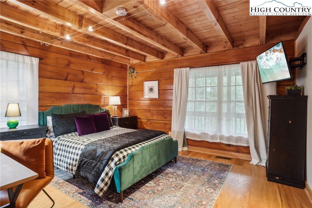 909 Niley Cook Road Blowing Rock, NC 28605 - Photo 17 of 45 a bedroom with a bed and a shower