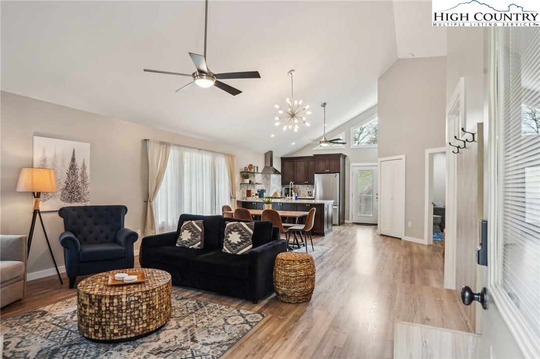 909 Niley Cook Road Blowing Rock, NC 28605 - Photo 27 of 45 a living room with furniture a ceiling fan and a window