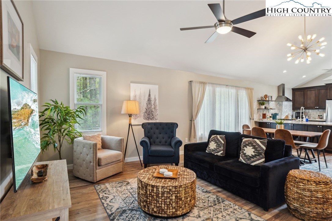 909 Niley Cook Road Blowing Rock, NC 28605 - Photo 28 of 45 a living room with furniture potted plant and a window