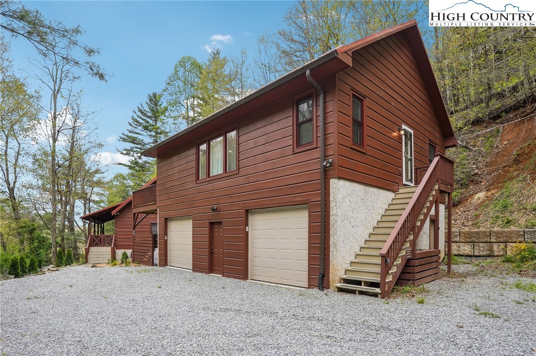 909 Niley Cook Road Blowing Rock, NC 28605 - Photo 38 of 45 a front view of a house with a yard