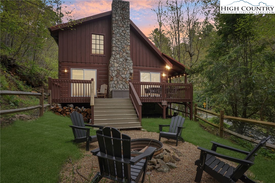 909 Niley Cook Road Blowing Rock, NC 28605 - Photo 45 of 45 a view of a chairs and table in backyard of the house