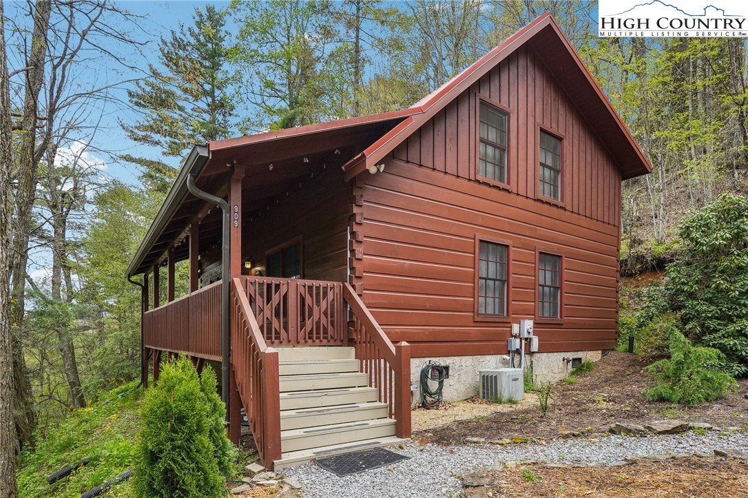 909 Niley Cook Road Blowing Rock, NC 28605 - Photo 5 of 45 a view of a house with a yard