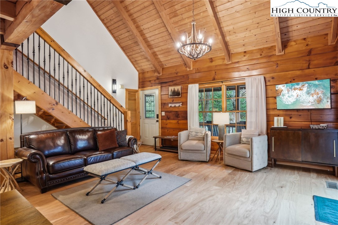 909 Niley Cook Road Blowing Rock, NC 28605 - Photo 8 of 45 a living room with furniture ceiling fan and a rug