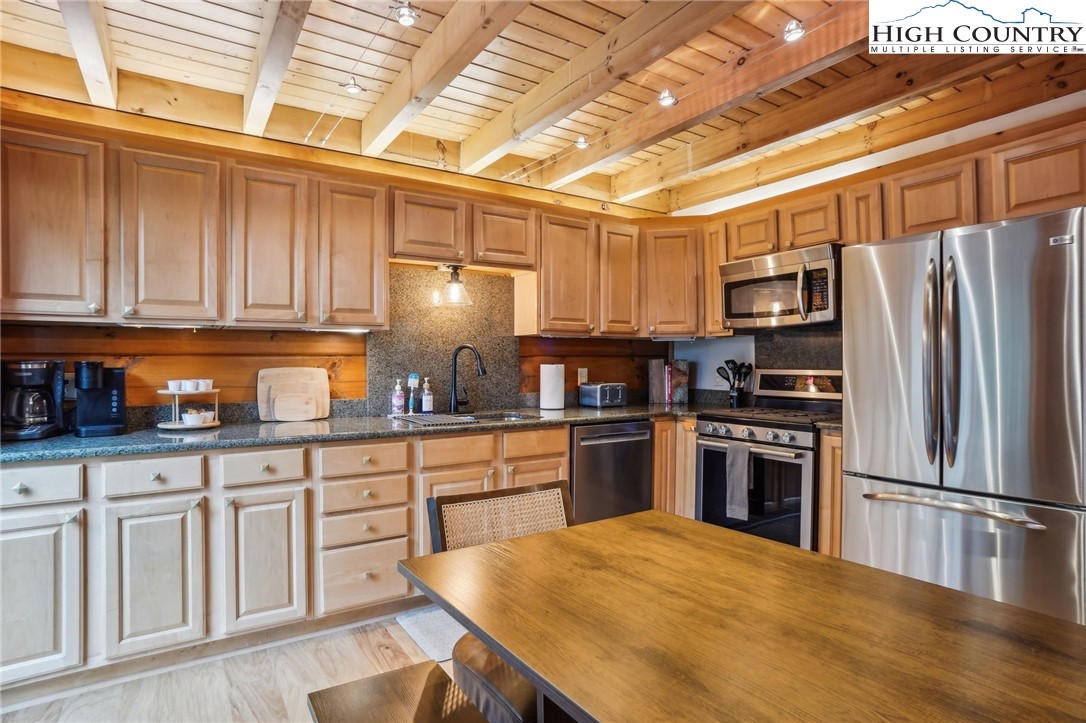 909 Niley Cook Road Blowing Rock, NC 28605 - Photo 10 of 45 a kitchen with granite countertop a sink appliances and cabinets