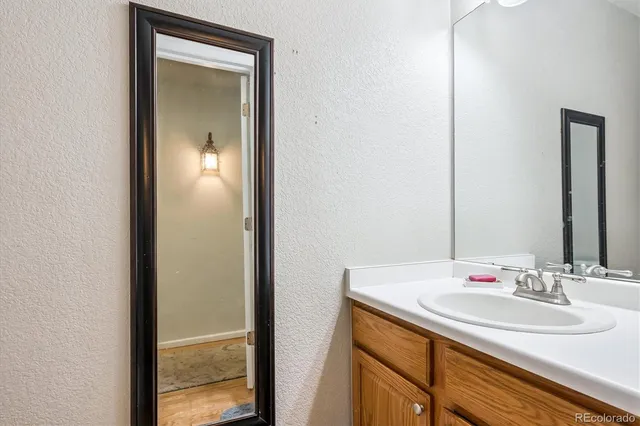 a bathroom with a sink and a mirror