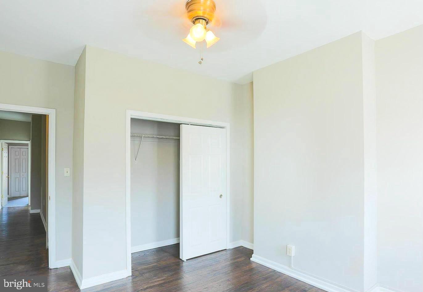 1114 West Cross Street Baltimore, MD 21230 - Photo 12 of 19 a view of an empty room with wooden floor
