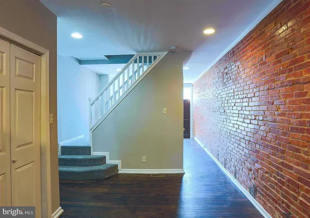 a view of entryway with wooden floor