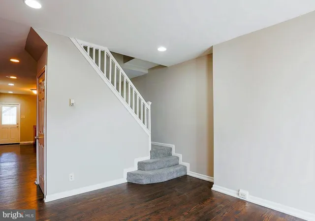a view of an entryway with wooden floor