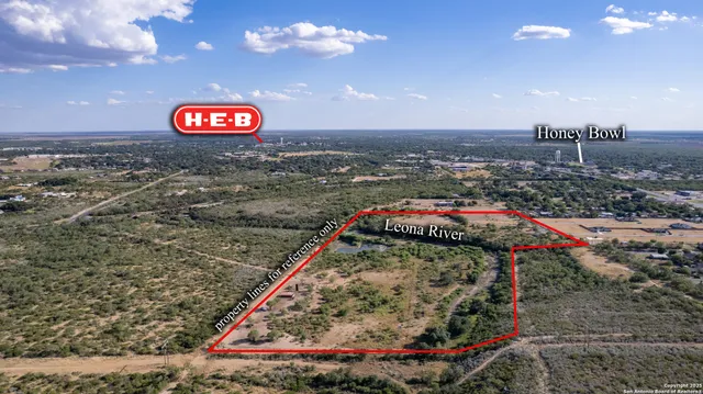 an aerial view of a houses with yard