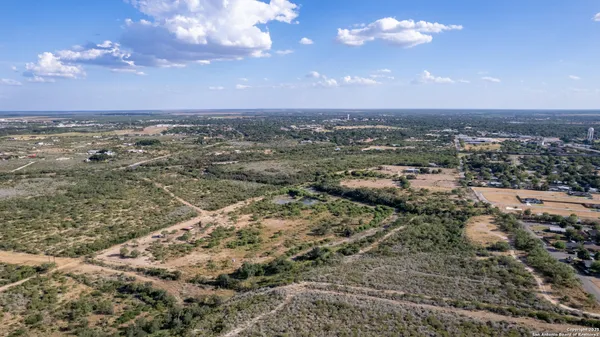 a view of a lake with houses in the back