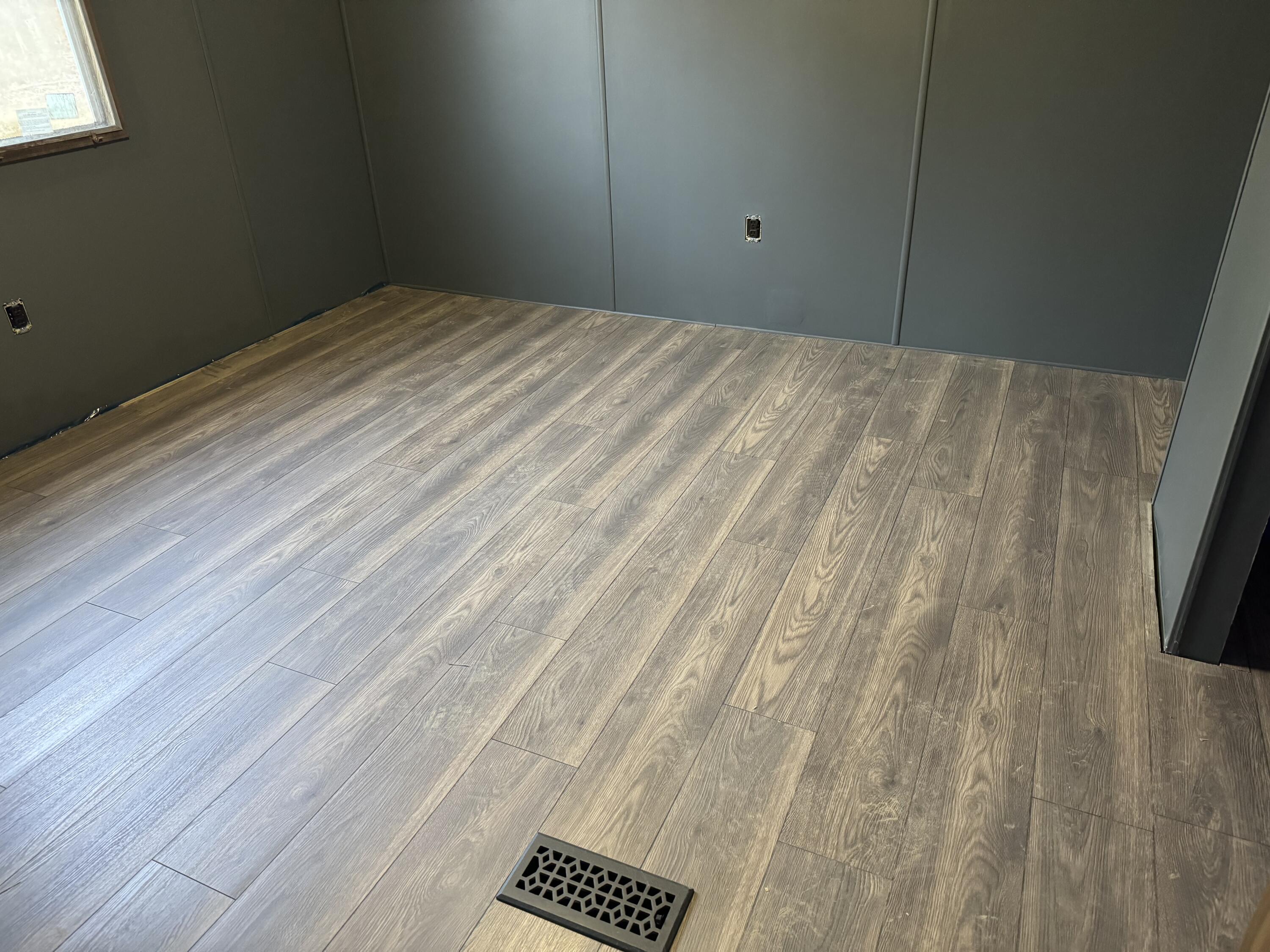1207 Flint Hill Road Moneta, VA 24121 - Photo 8 of 10 a view of empty room with wooden floor