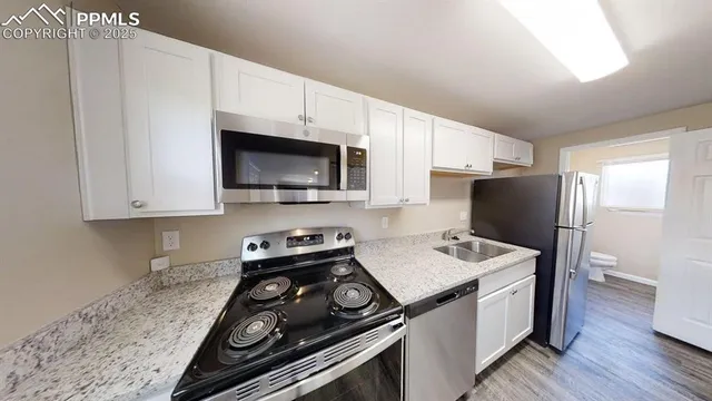 a kitchen with a stove and a microwave