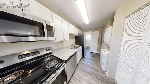a kitchen with a stove and a microwave