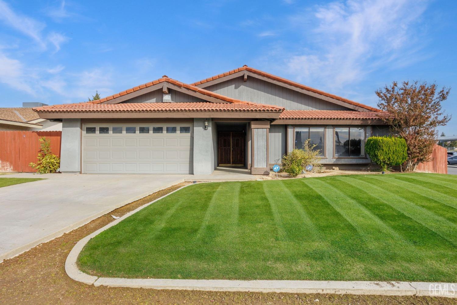 Undisclosed Address Bakersfield, CA 93306 - Photo 1 of 51 front view of a house with a yard