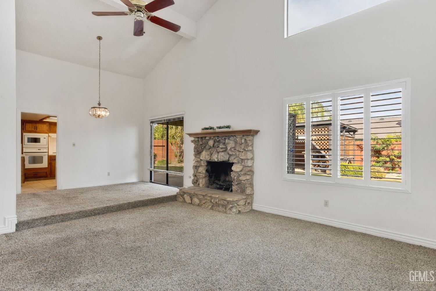 Undisclosed Address Bakersfield, CA 93306 - Photo 16 of 51 a view of a livingroom with a fireplace and window