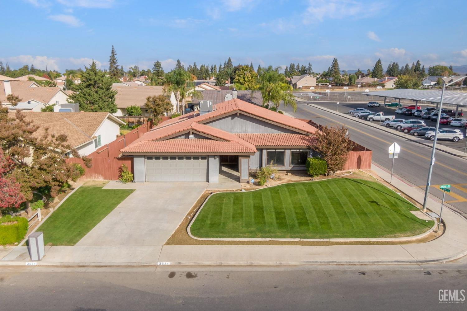 Undisclosed Address Bakersfield, CA 93306 - Photo 2 of 51 a house with trees in the background