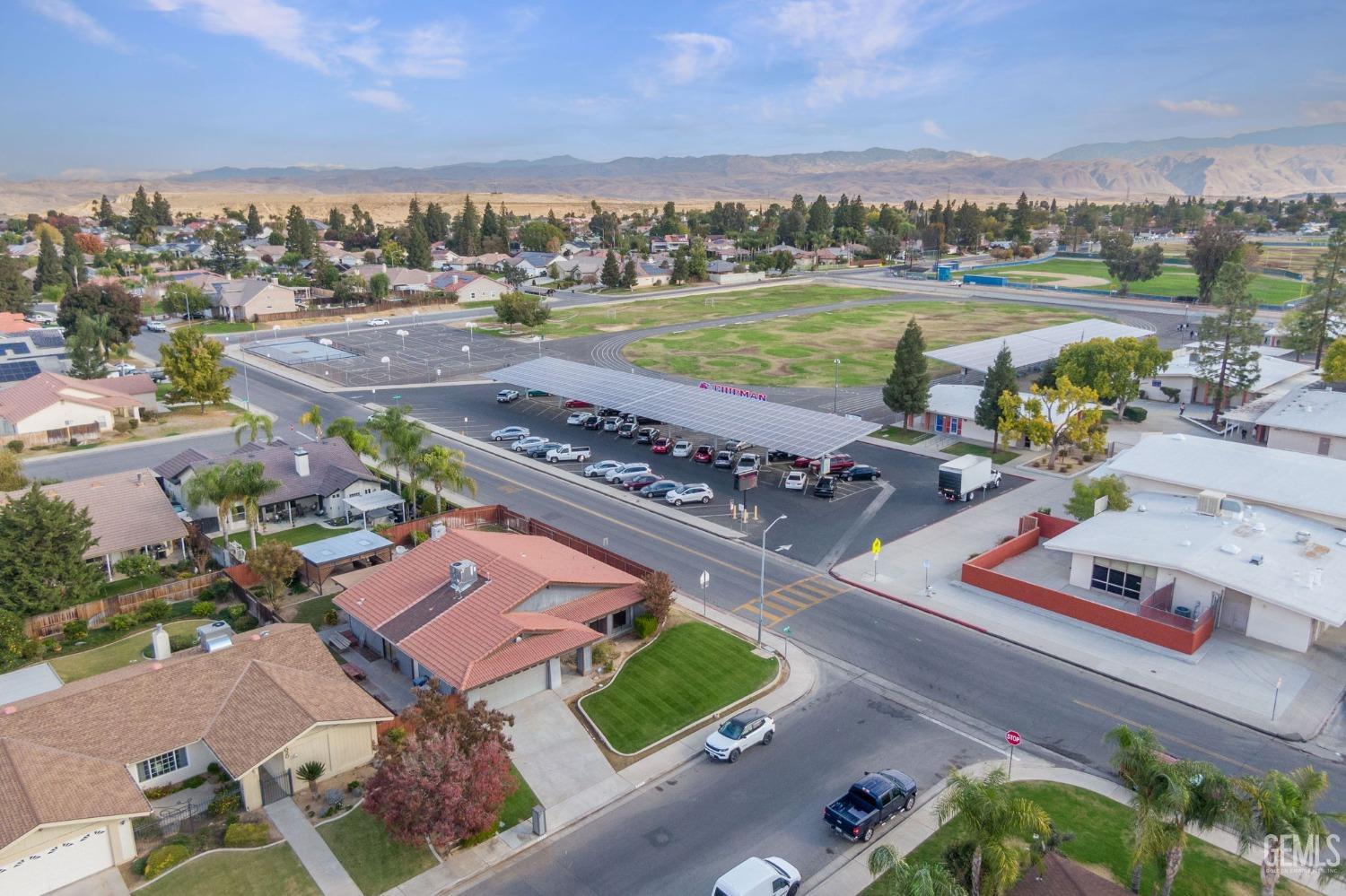 Undisclosed Address Bakersfield, CA 93306 - Photo 4 of 51 an aerial view of a house with a lake