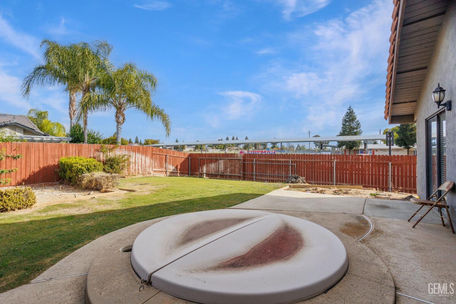Undisclosed Address Bakersfield, CA 93306 - Photo 44 of 51 a view of a backyard with swimming pool