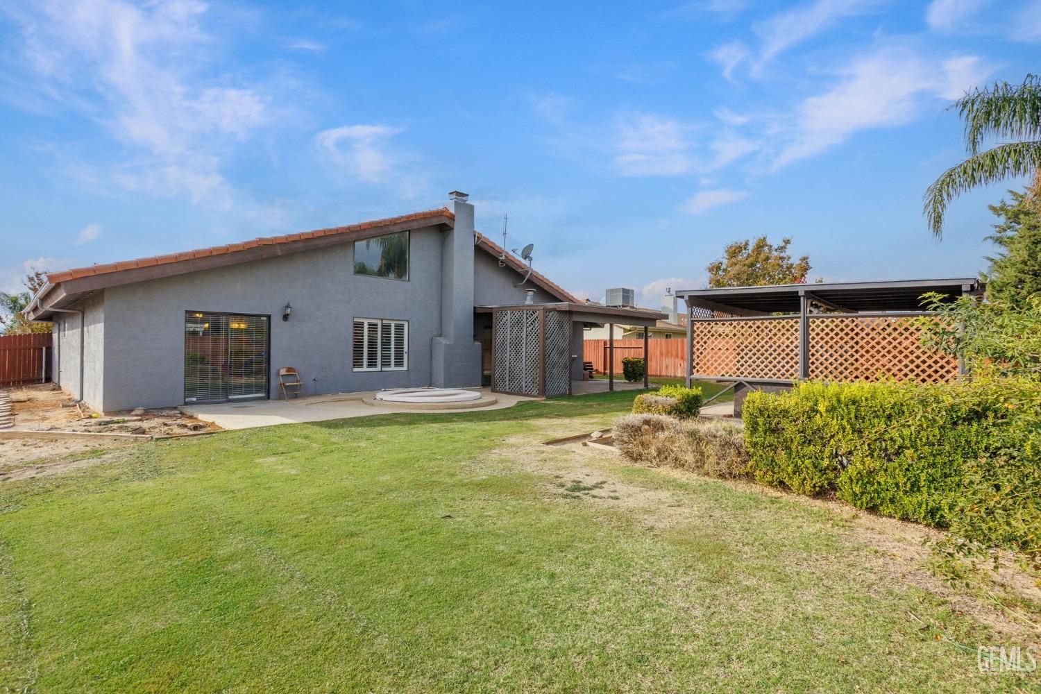 Undisclosed Address Bakersfield, CA 93306 - Photo 46 of 51 a front view of a house with a yard