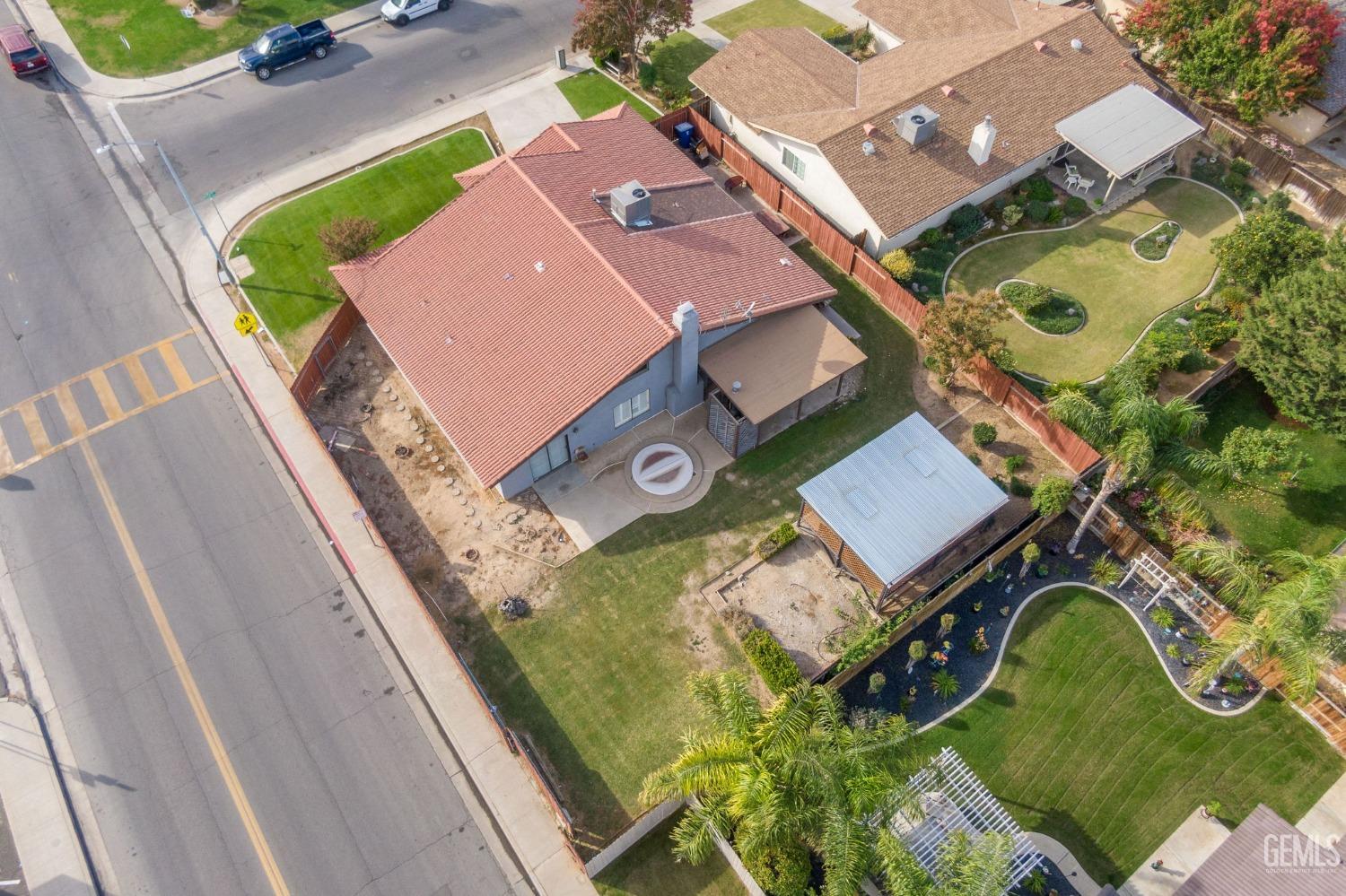 Undisclosed Address Bakersfield, CA 93306 - Photo 48 of 51 an aerial view of a house with a swimming pool