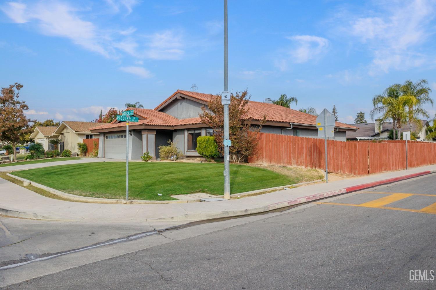 Undisclosed Address Bakersfield, CA 93306 - Photo 6 of 51 a view of a house with a yard and fence