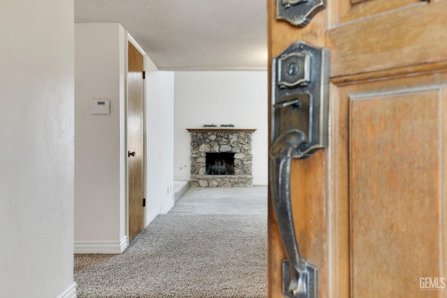 Undisclosed Address Bakersfield, CA 93306 - Photo 9 of 51 a view of a livingroom with a fireplace