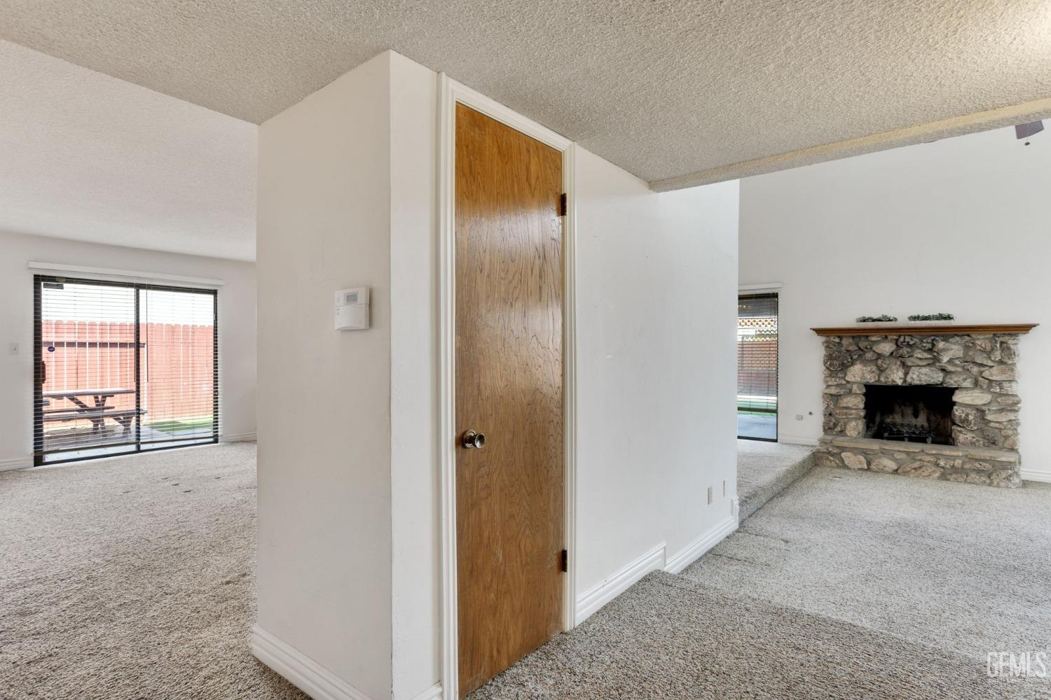 Undisclosed Address Bakersfield, CA 93306 - Photo 10 of 51 a view of a livingroom with a fireplace