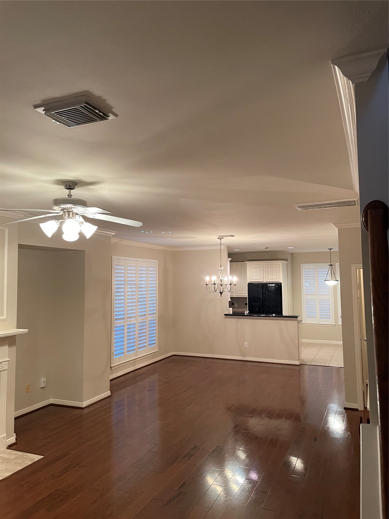 1040 La Rue Street Houston, TX 77019 - Photo 27 of 29 an empty room with wooden floor and windows