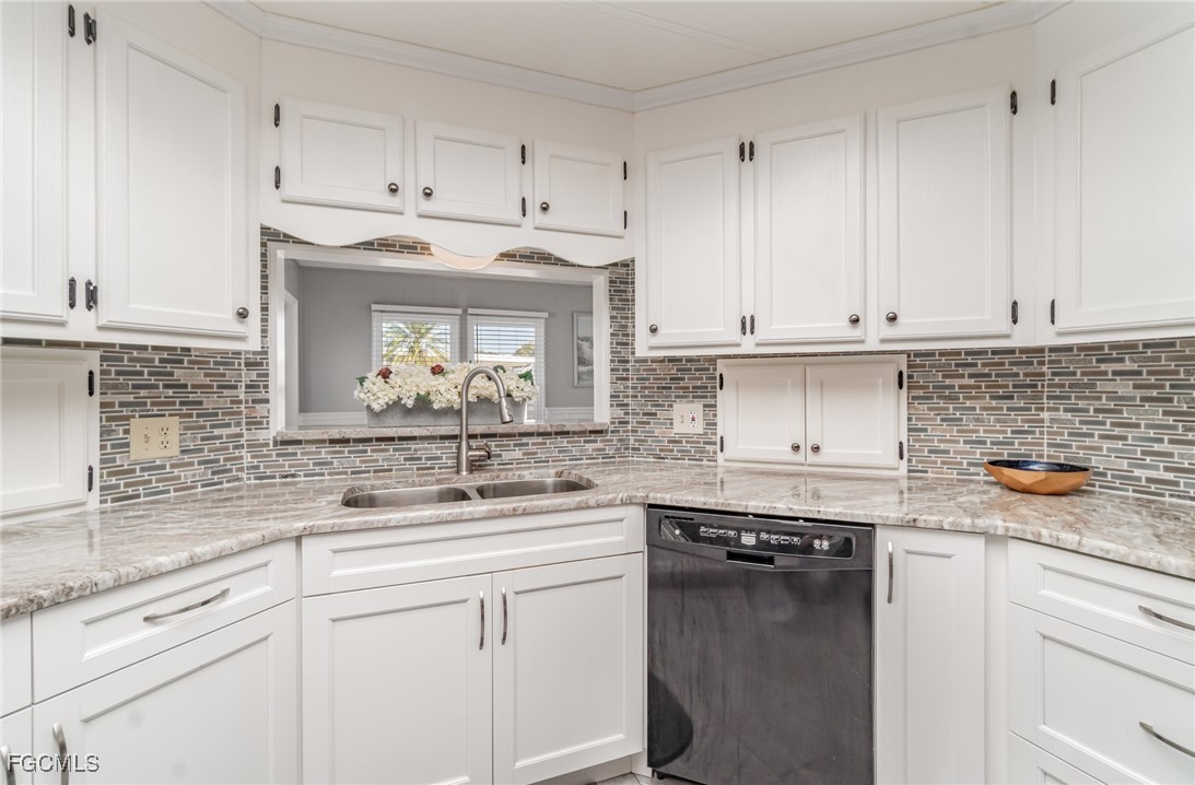 5508 Colonial Road North Fort Myers, FL 33917 - Photo 11 of 31 a kitchen with stainless steel appliances granite countertop a sink stove and cabinets