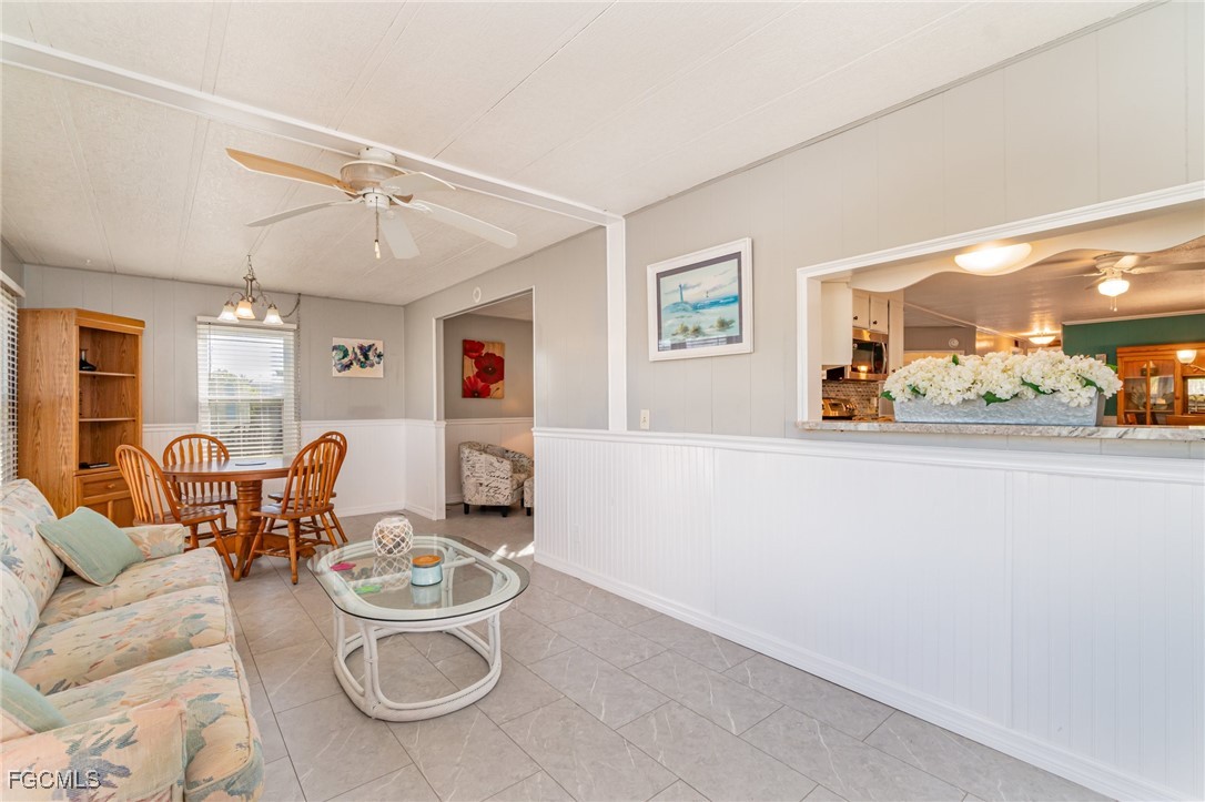 5508 Colonial Road North Fort Myers, FL 33917 - Photo 13 of 31 a living room with furniture and a table