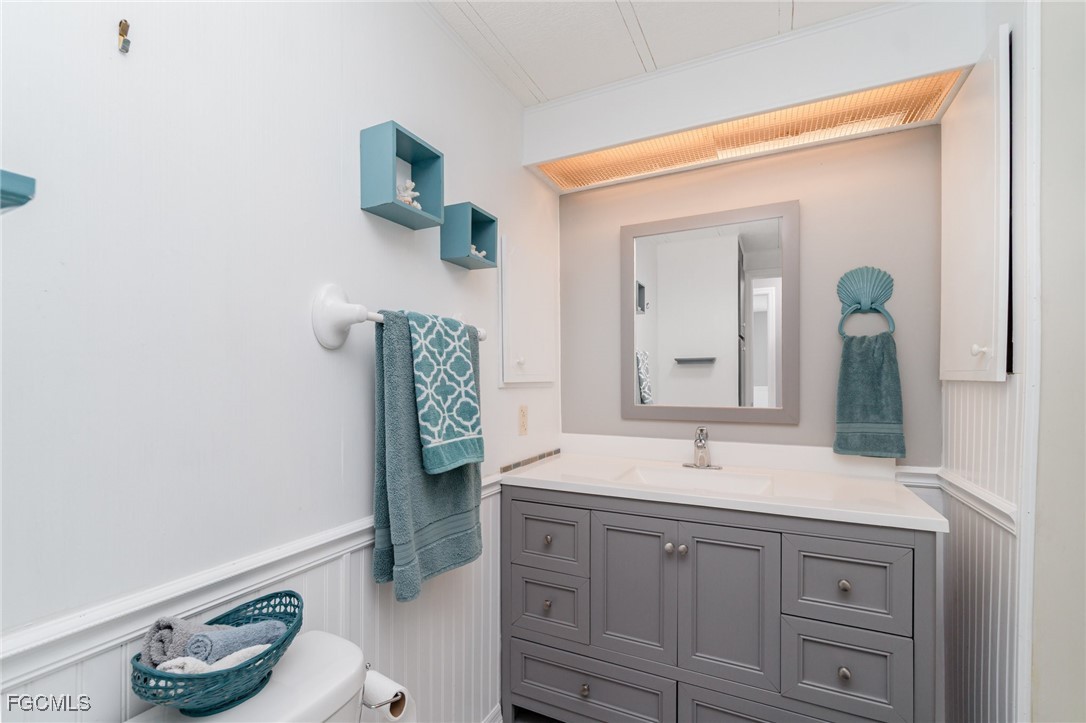 5508 Colonial Road North Fort Myers, FL 33917 - Photo 14 of 31 a bathroom with a sink and a mirror