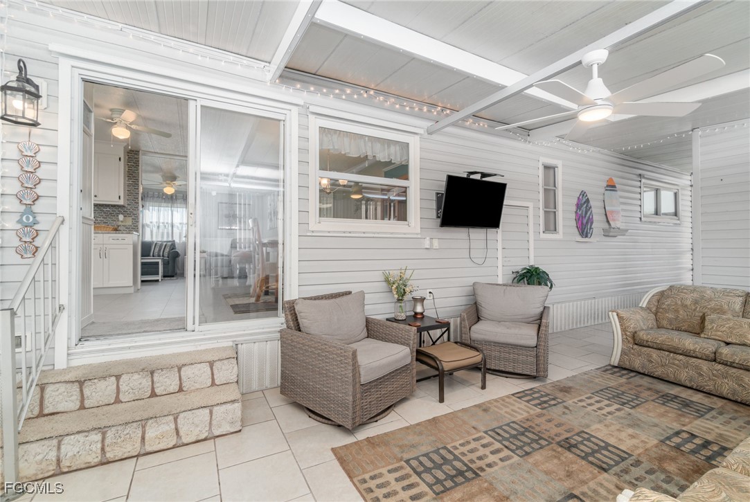 5508 Colonial Road North Fort Myers, FL 33917 - Photo 21 of 31 a living room with furniture and a flat screen tv