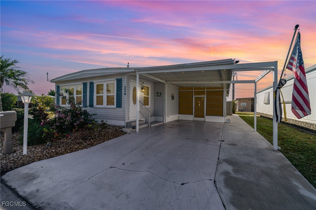 5508 Colonial Road North Fort Myers, FL 33917 - Photo 5 of 31 front view of a house with a yard