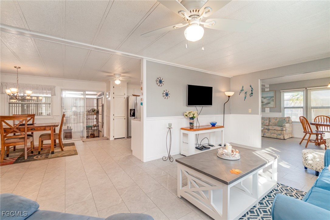 5508 Colonial Road North Fort Myers, FL 33917 - Photo 8 of 31 a living room with furniture and a flat screen tv