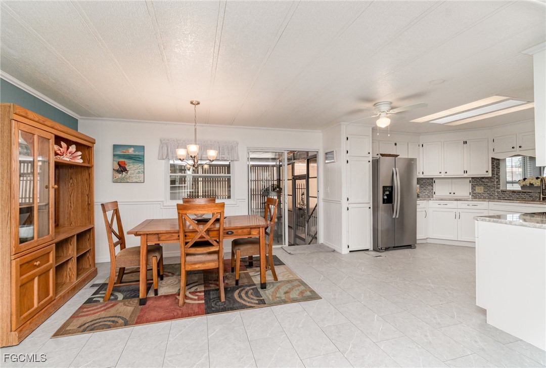 5508 Colonial Road North Fort Myers, FL 33917 - Photo 9 of 31 a view of a dining room with furniture