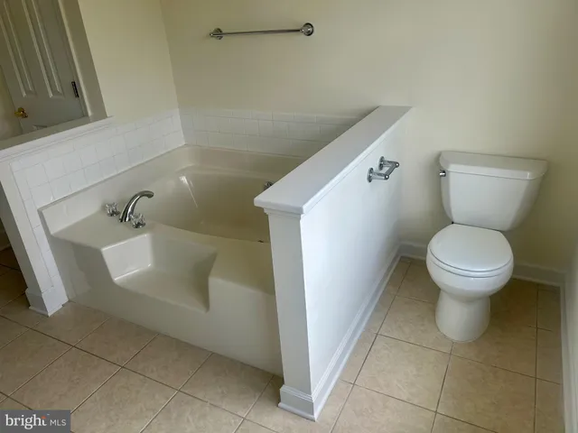 a bathroom with a toilet and a sink