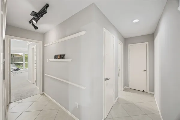a bathroom with a granite countertop sink mirror and double