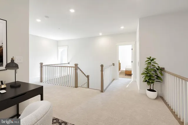 a living room with furniture and flowers