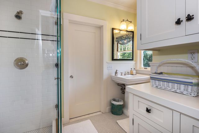 a bathroom with a sink and a mirror